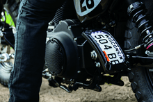 Load image into Gallery viewer, Kuryakyn Nova Curved Vertical Mount Side License Plate Holder Gloss Black - Powersports Haven